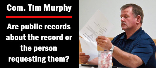Photo of Commissioner Tim Murphy with copy: are  public records about the record or the person requesting them?