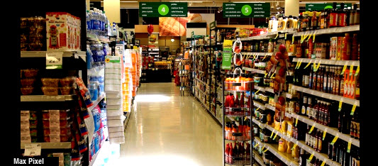 supermarket isle with fully stocked shelves