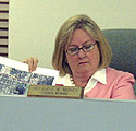 Councilwoman Moses studies the issue.