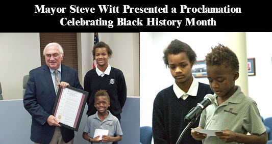 Mayor Witt presents Black History Month proclamatin to Victoria and Michael Coker