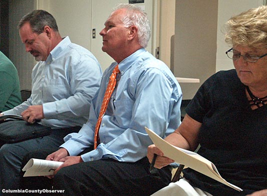 From left to right waiting to be introduced: FGC's John Jewett, College spokesperson Mike McKee, and Sue Sommer, an education advocate and expert in FGC's Water Resource Programs. The smug looks of Mr. Jewett and Mr. McKee is not shared by Ms. Sommer. They knew something she didn't.