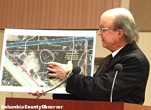 Attorney Terrell Arline points to the site plan.