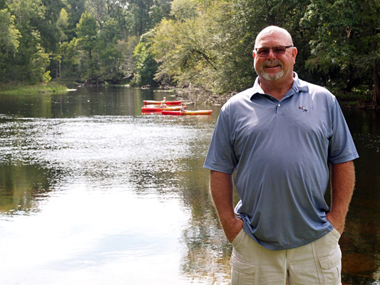 Commissioner Rocky Ford on the bank of the Santa Fe River and Rum Island Park