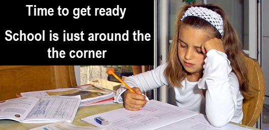 Little girl doing homework: "time to get ready - school is just around the corner."