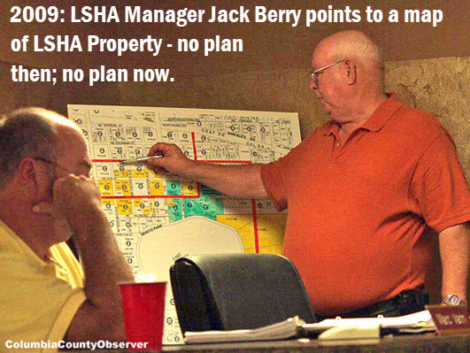 photo of LSHA Manager Jack Berry from 2009 pointing to a map of LSHA properties.