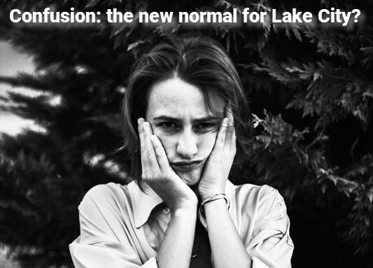 Photo: girl with hands holding head. Copy: Confusion, the new normal for Lake City?