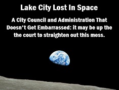 Photo of the earth rising from the moon with caption: Lake City lost in space.