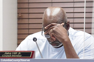 ouncilman Hill ponders the resumes before he spoke up and shared his City Manager requirements.