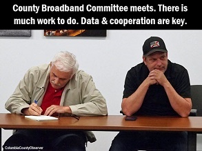 Photo of former County Manager Dale Williams and County Chairman Toby Witt with caption: County Boradband Committee meets. There is much work to do. Data and cooperation are key.