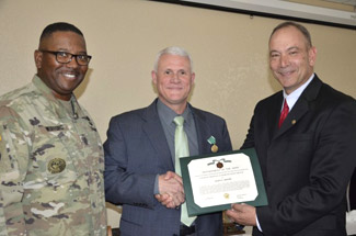 Glen Adams receiving an award for his service at White Sands Missle Range.