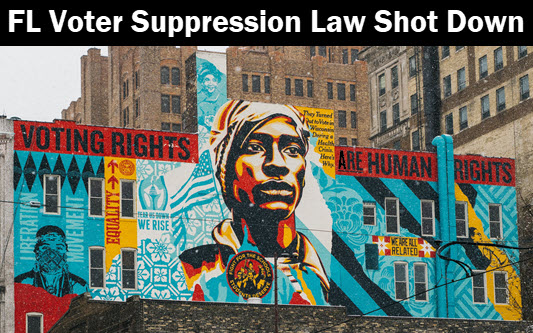 Photo of wall mural with caption: Florida voter suppression law shot down