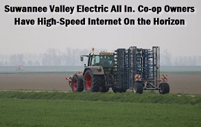 Tractor in field with caption: Suwannee Valley Electric all in. Co-op owners have hight-speed internet on the horizon