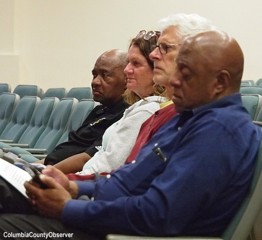 Richardson Community Center board members and County Recreation Dir. Mario Coppock (left) listen to the County 5.