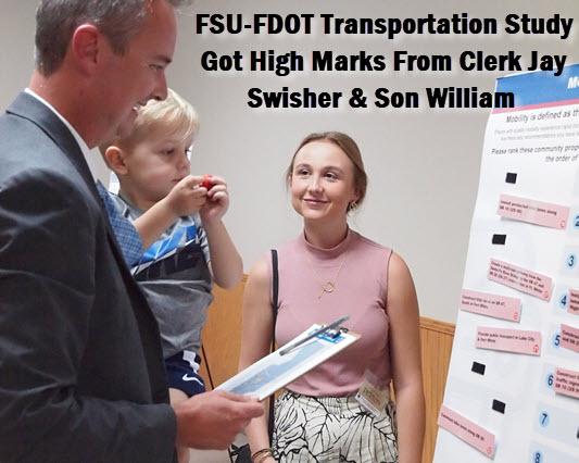 Clerk of the Courts Jay Swisher and son William review the County transportation projects