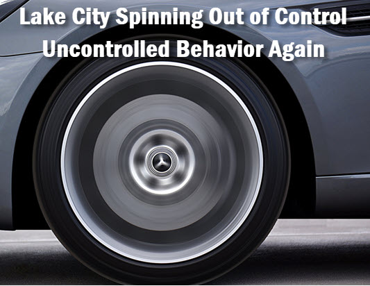 Auto    spinning tires with headline: Lake City Mayor loses control. Allows file and uncontrolled meeting behavior once again.