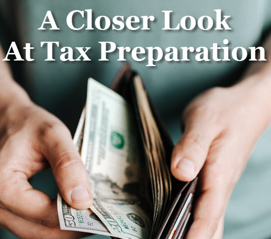 Person holding open wallet with headline: A closer look at tax preparation