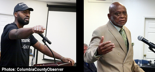 Sylvester Warren (left); Glenel Bowden (right) at the podium in City Hall.