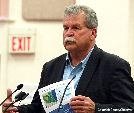 SRWMD Executive Director Hugh Thomas holding Water First handout